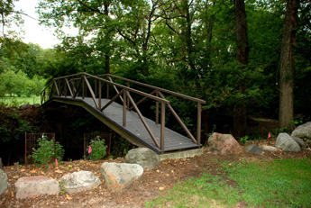 Foot bridge that provides access to the Arboretum received repair and maintenance in 2012.