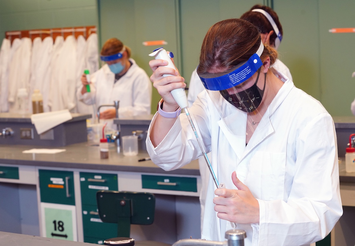 Student in lab with pipette