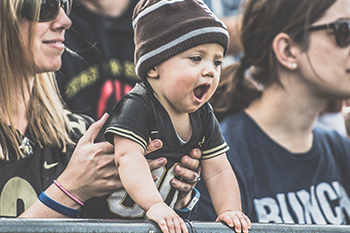 infant at a Purdue football game