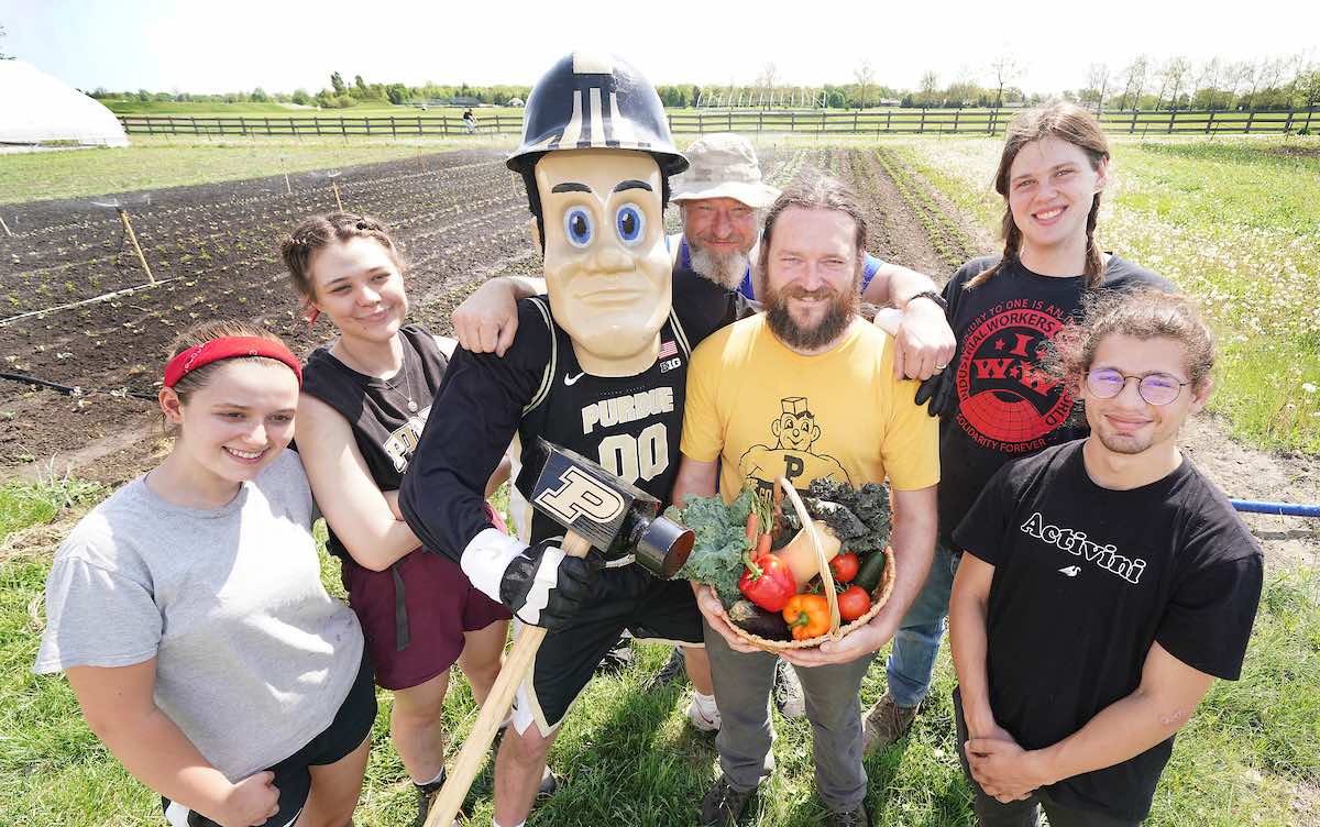 Purdue Student Farm students posing with Purdue Pete