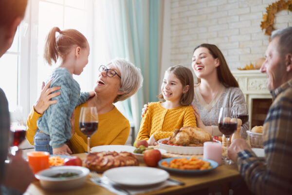 multigenerational family gathered together at thanksgiving table