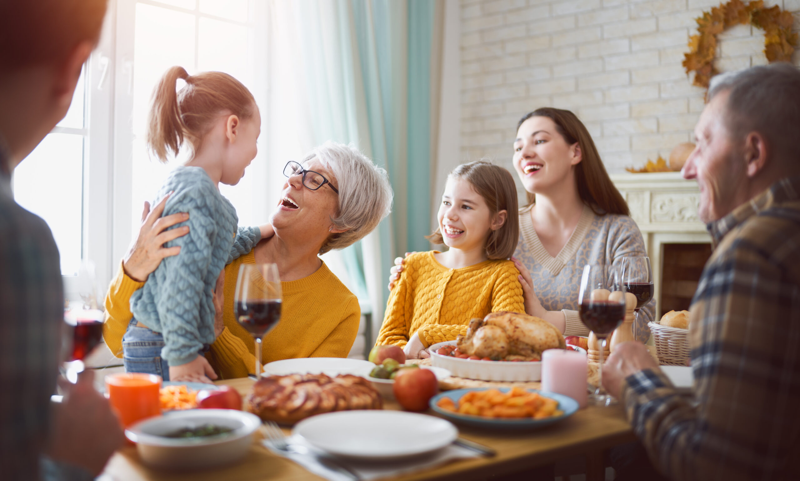 multigenerational family gathered together at thanksgiving table