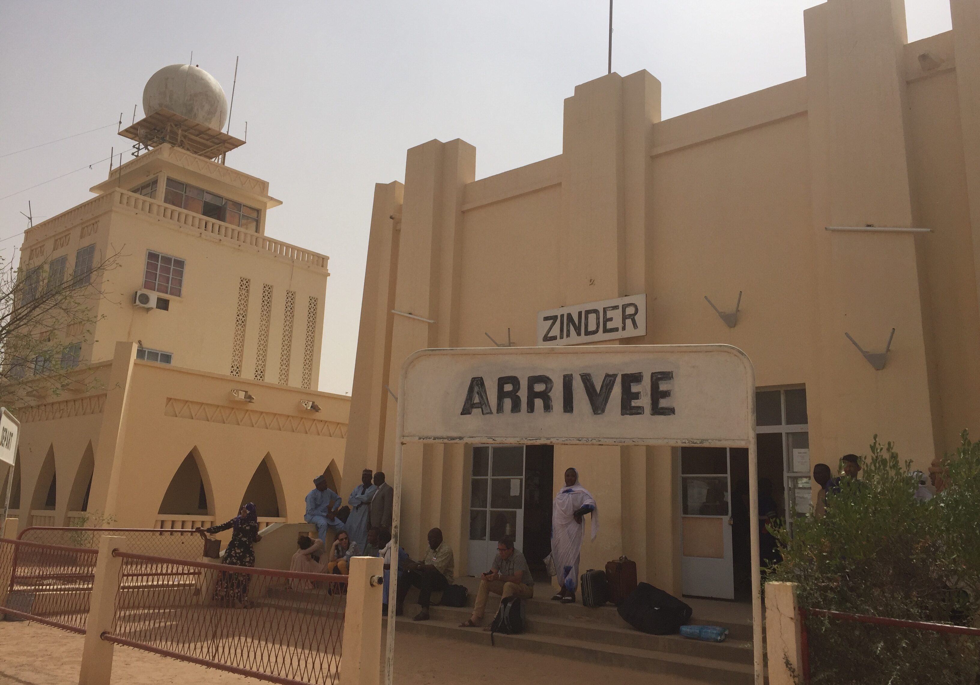 Kabir's plane was re-routed to Zinder becuase of dust storms. 
