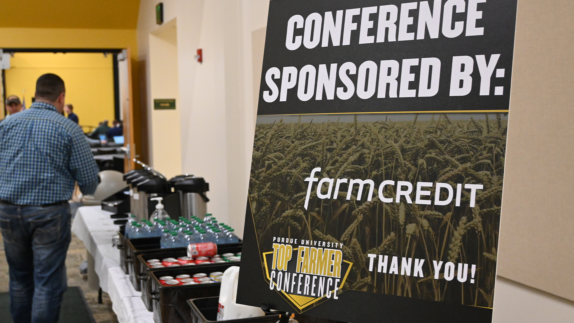 Purdue Top Farmer Conference sign with refreshment table