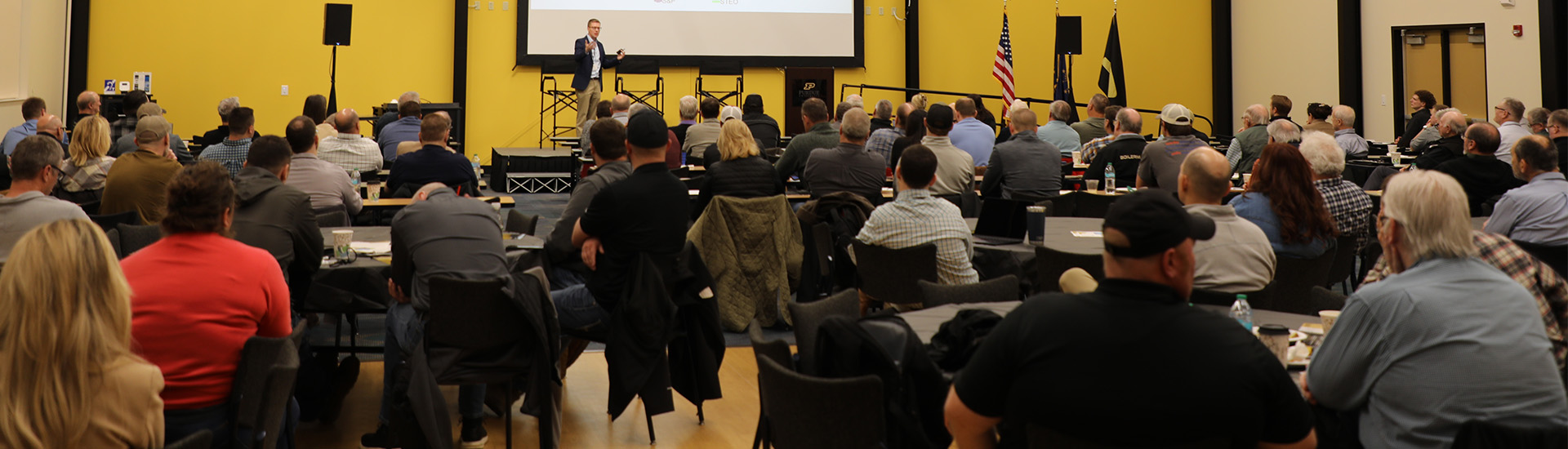 farmers and agribusiness professionals listening to presentation during the Purdue University Top Farmer Conference