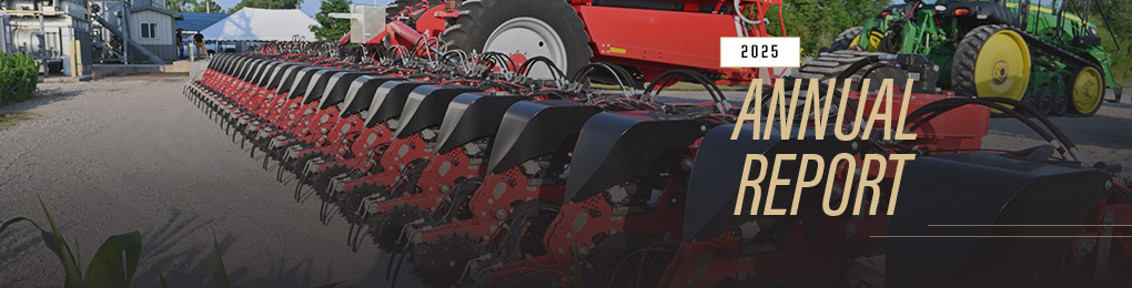 2025 Annual Report cover image of tractor and drill parked in front of farm grain bins