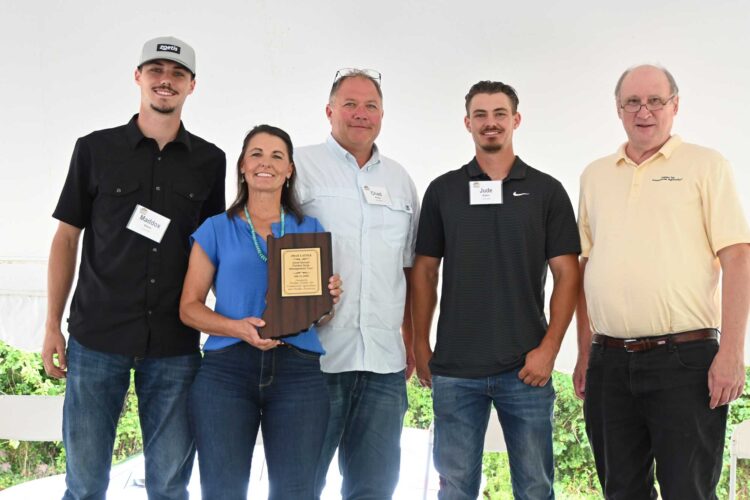 Maddox, Paige, Chad, and Jude Baker with Purdue's Michael Langemeier during the Purdue Farm Management Tour