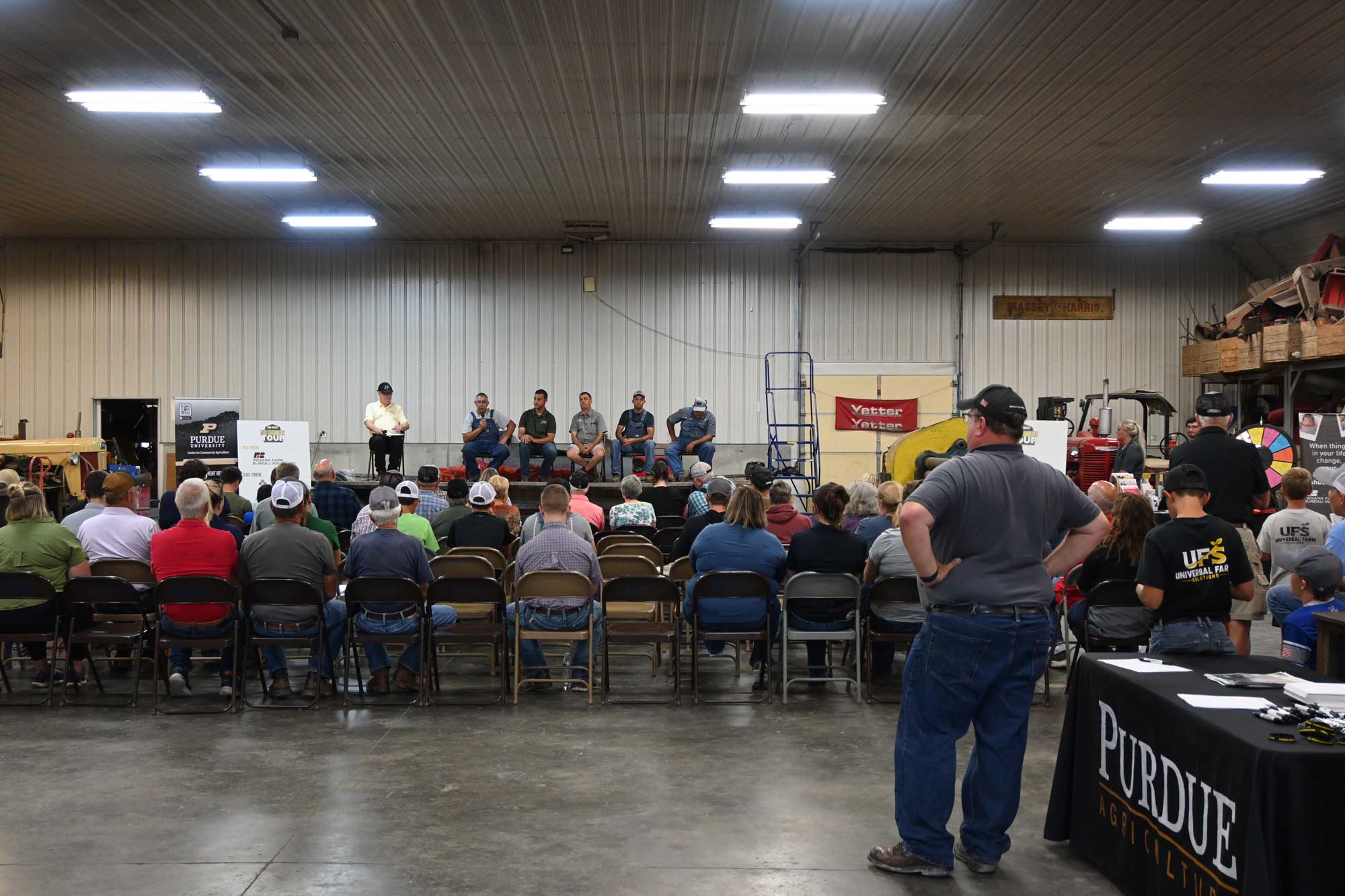 The Jones speaking to a crowd with Purdue's Michael Langemeier during the Purdue Farm Management Tour