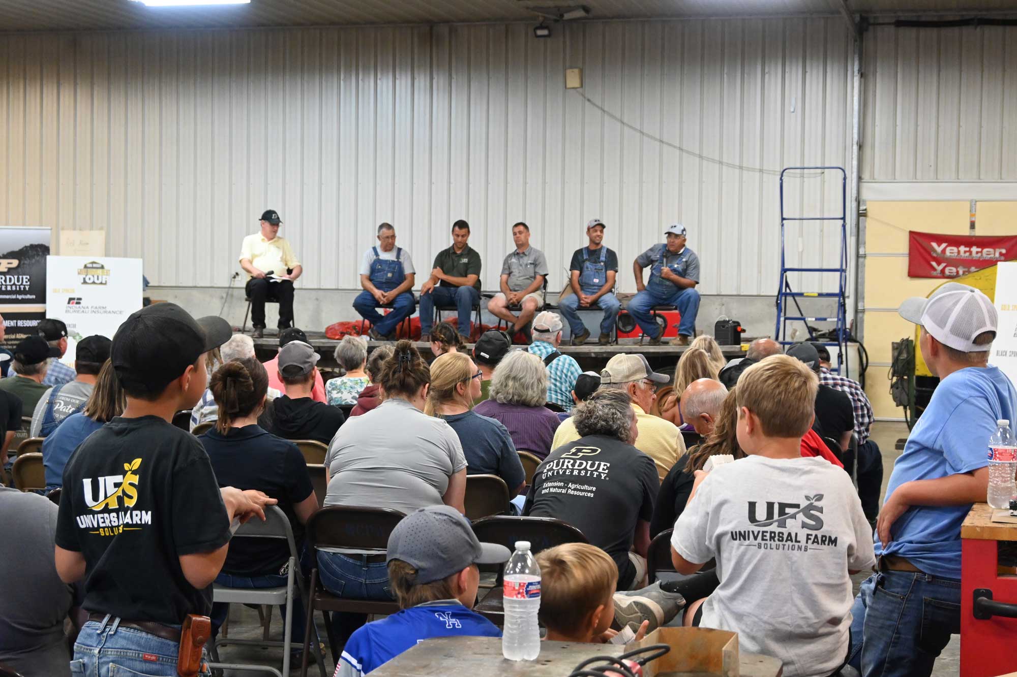 The Jones speaking to a crowd with Purdue's Michael Langemeier during the Purdue Farm Management Tour