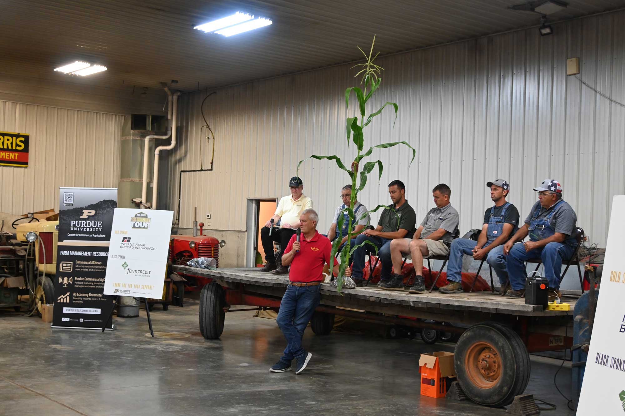 The Jones speaking to a crowd with Purdue's Michael Langemeier during the Purdue Farm Management Tour