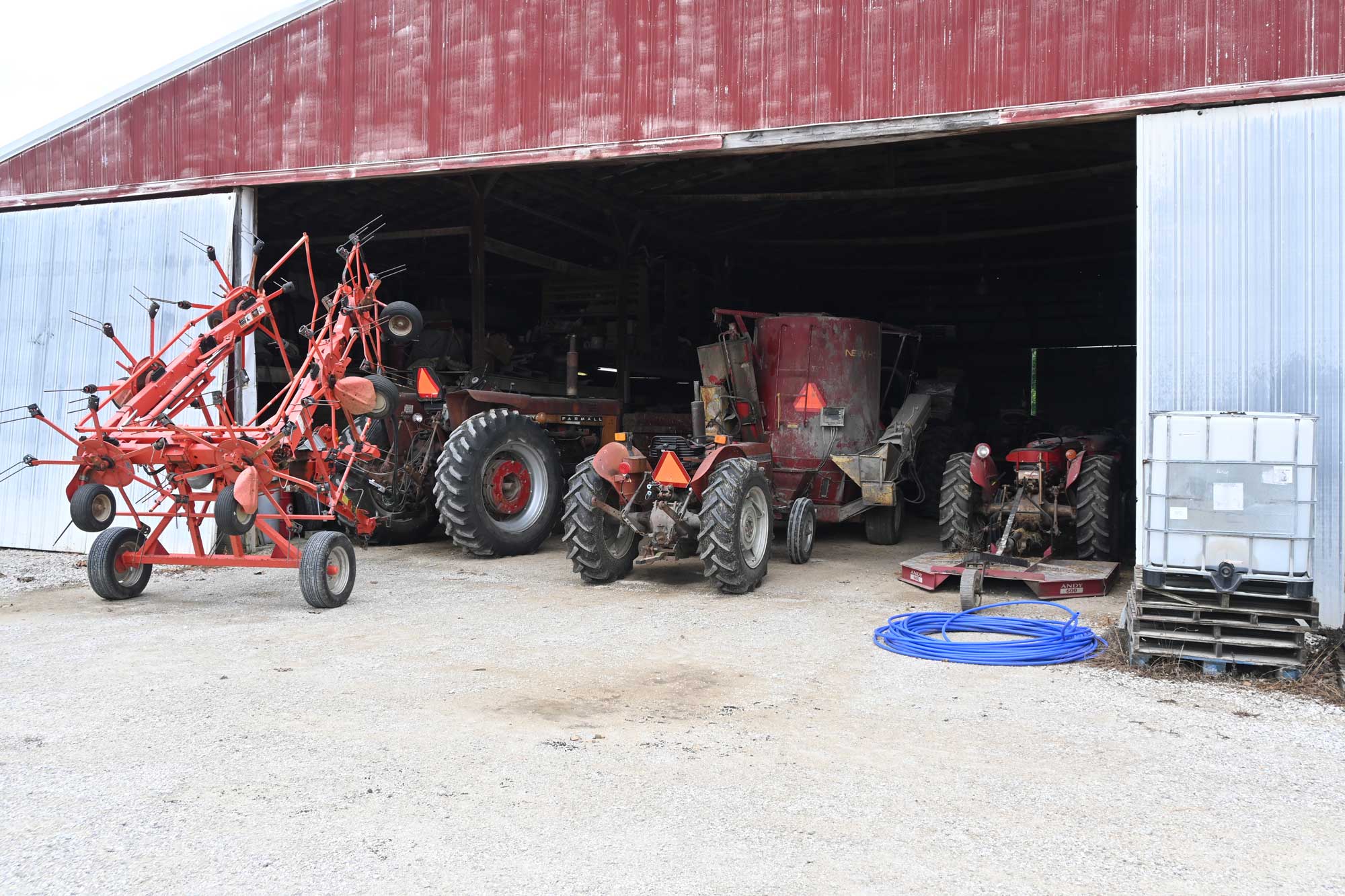 Red equipment in the shed at Jones Farm during the Purdue Farm Management Tour