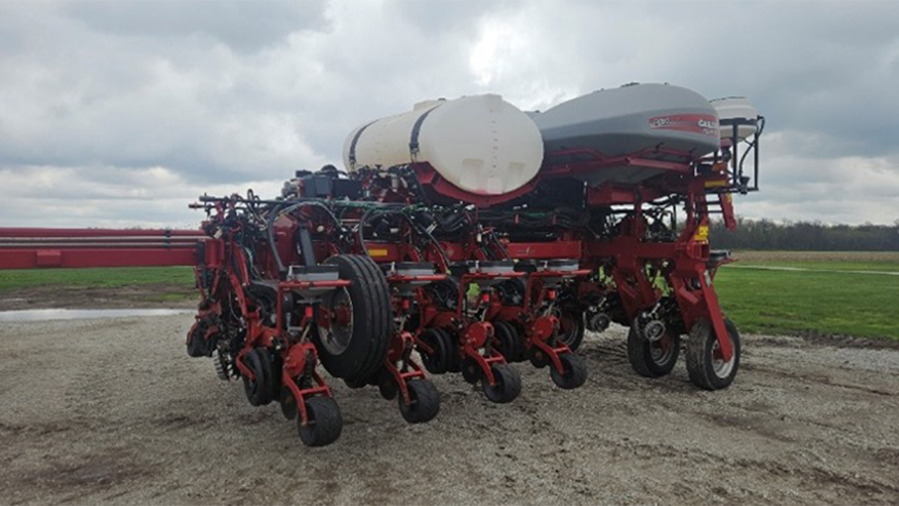 A 12-row Case 2150 planter with vacuum meters, active hydraulic downforce, and row cleaners.