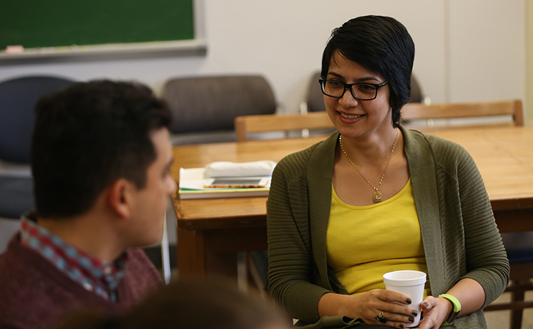 mati talking with a fellow student