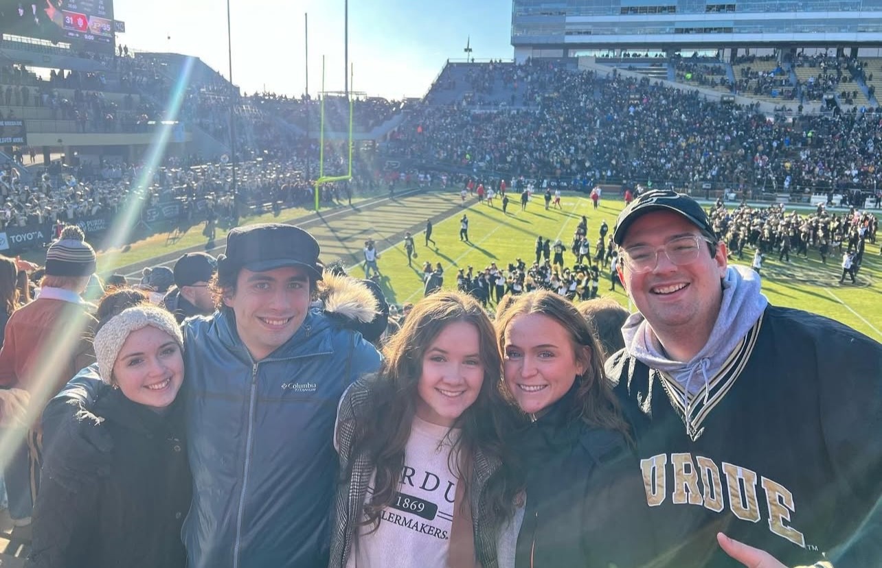 Dewey Robertson attending a Purdue football game with friends