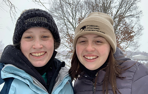 Two female students smiling