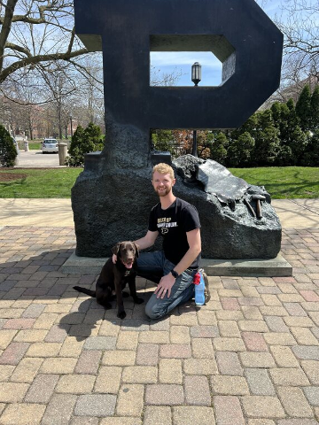 Stephens on campus with dog