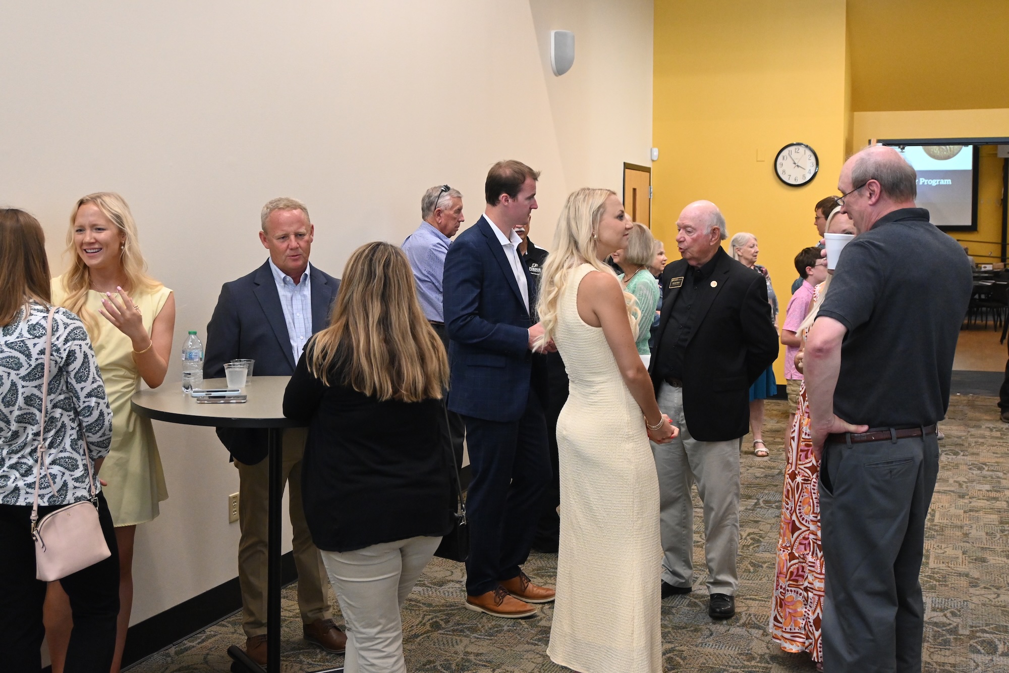 Master Farmer ceremony attendees talking in the hall of the Beck Agricultural Center