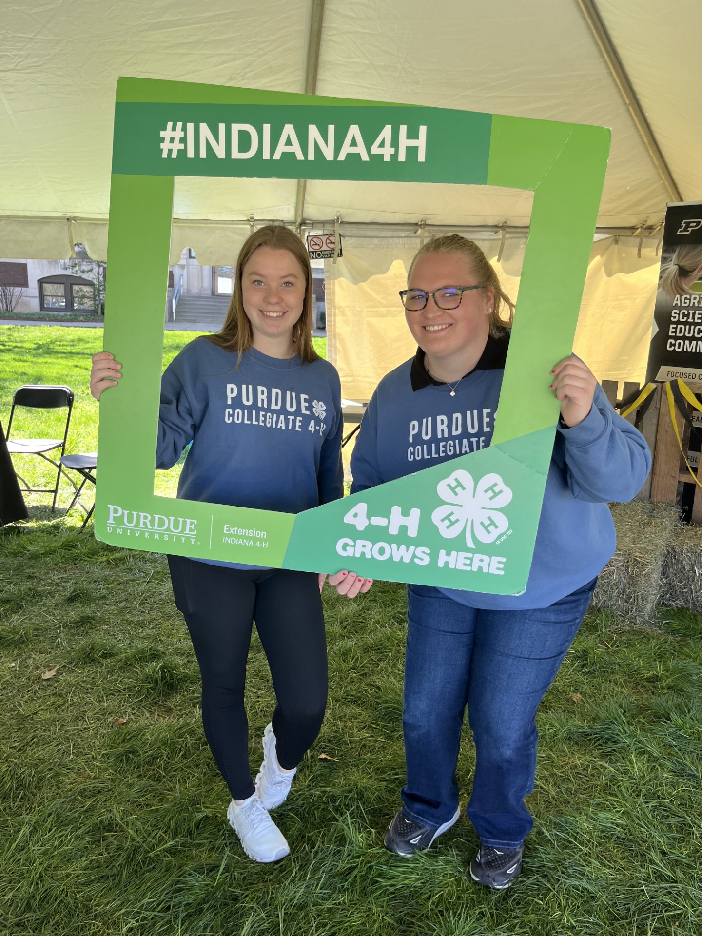 Kylie Bedel and friend with an Indiana 4-H sign