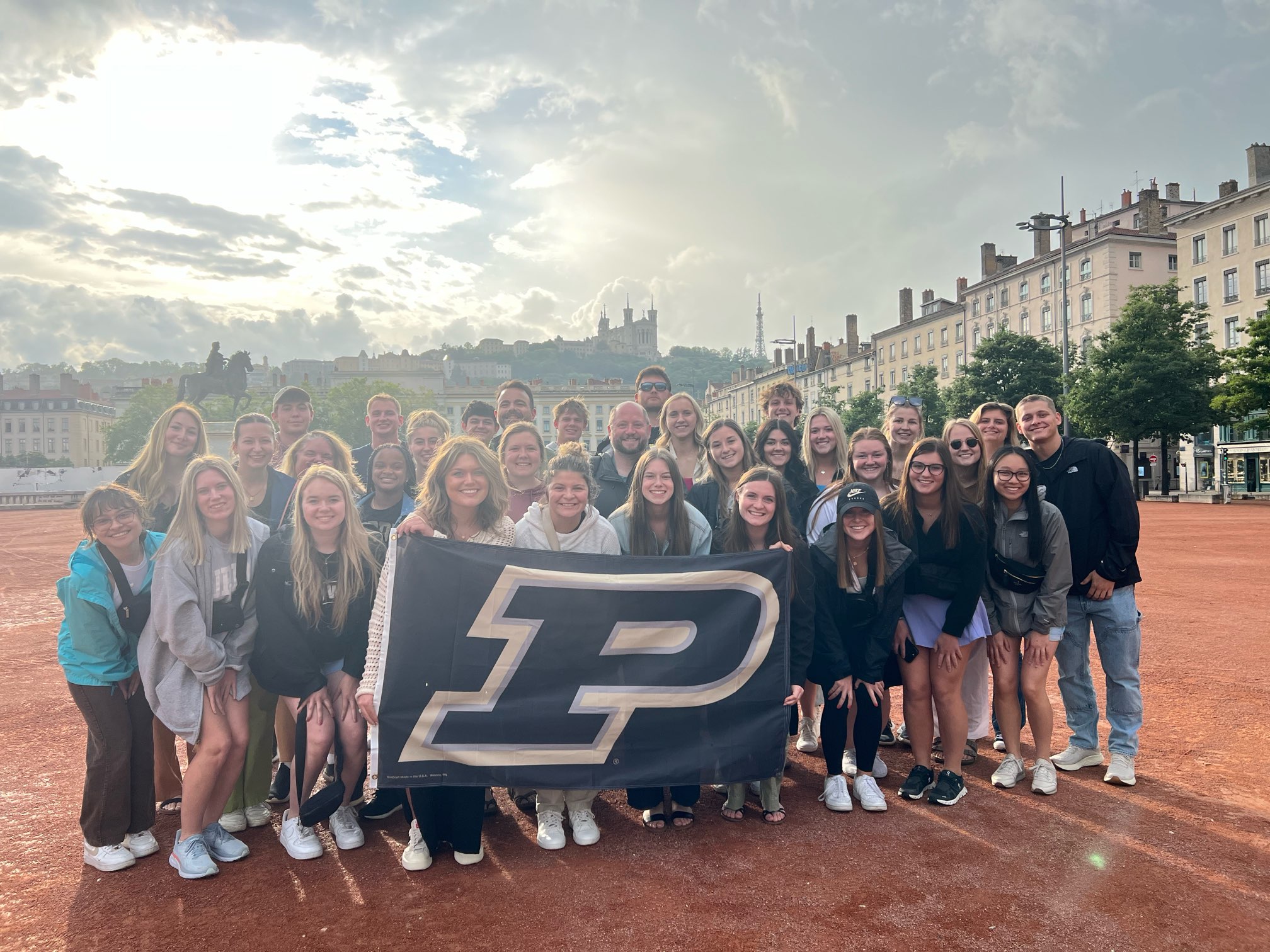 Grant Bell standing with students on France May-mester study abroad trip