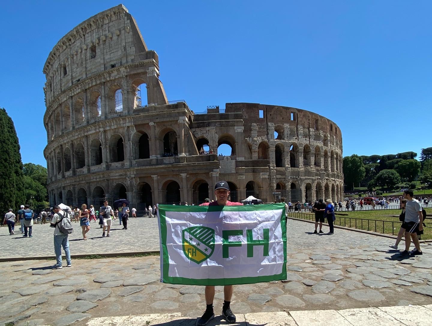 Blayne Vandeveer studying abroad standing in front of the Colosseum in Rome