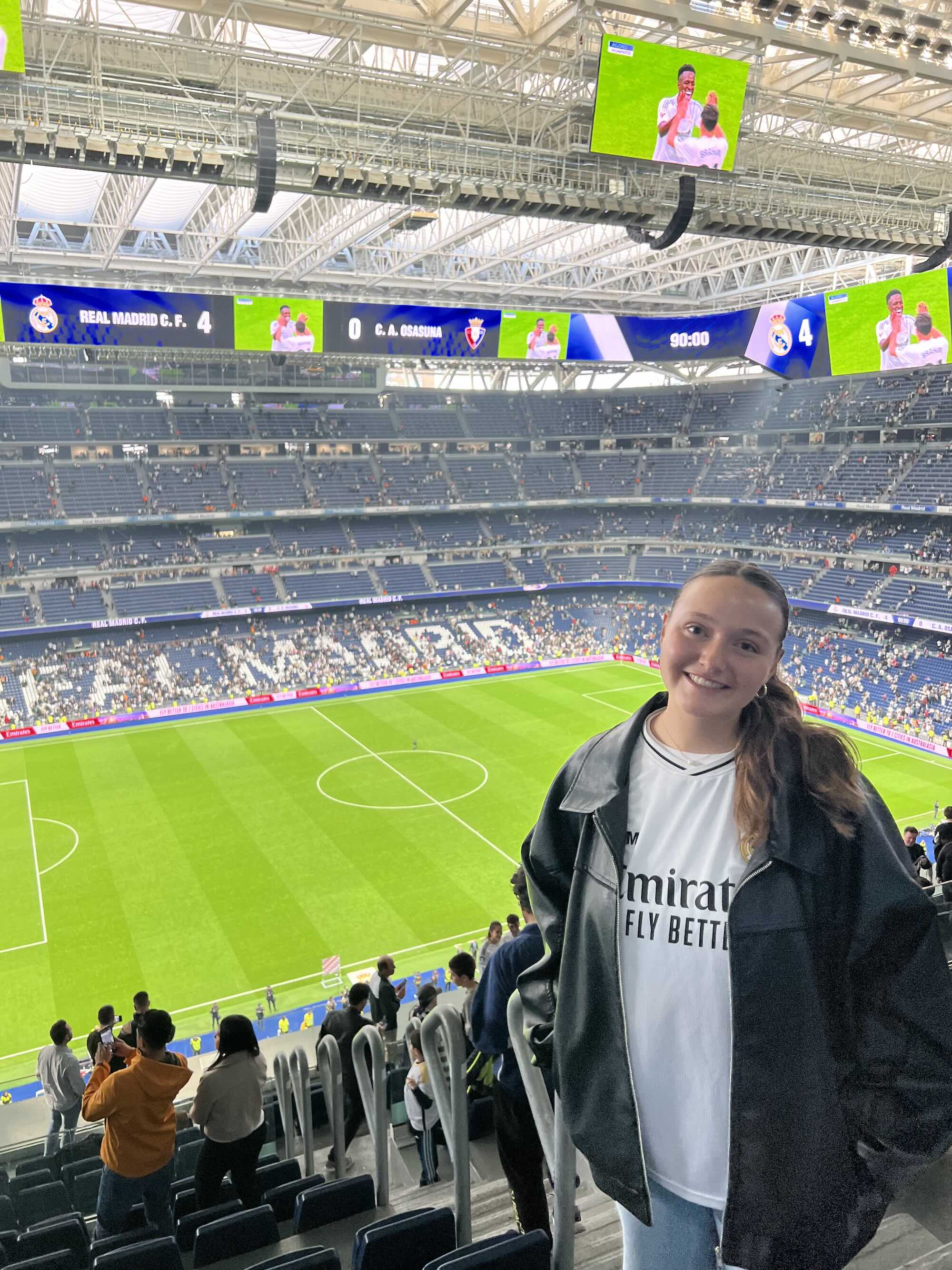 Taylor in front of soccer field