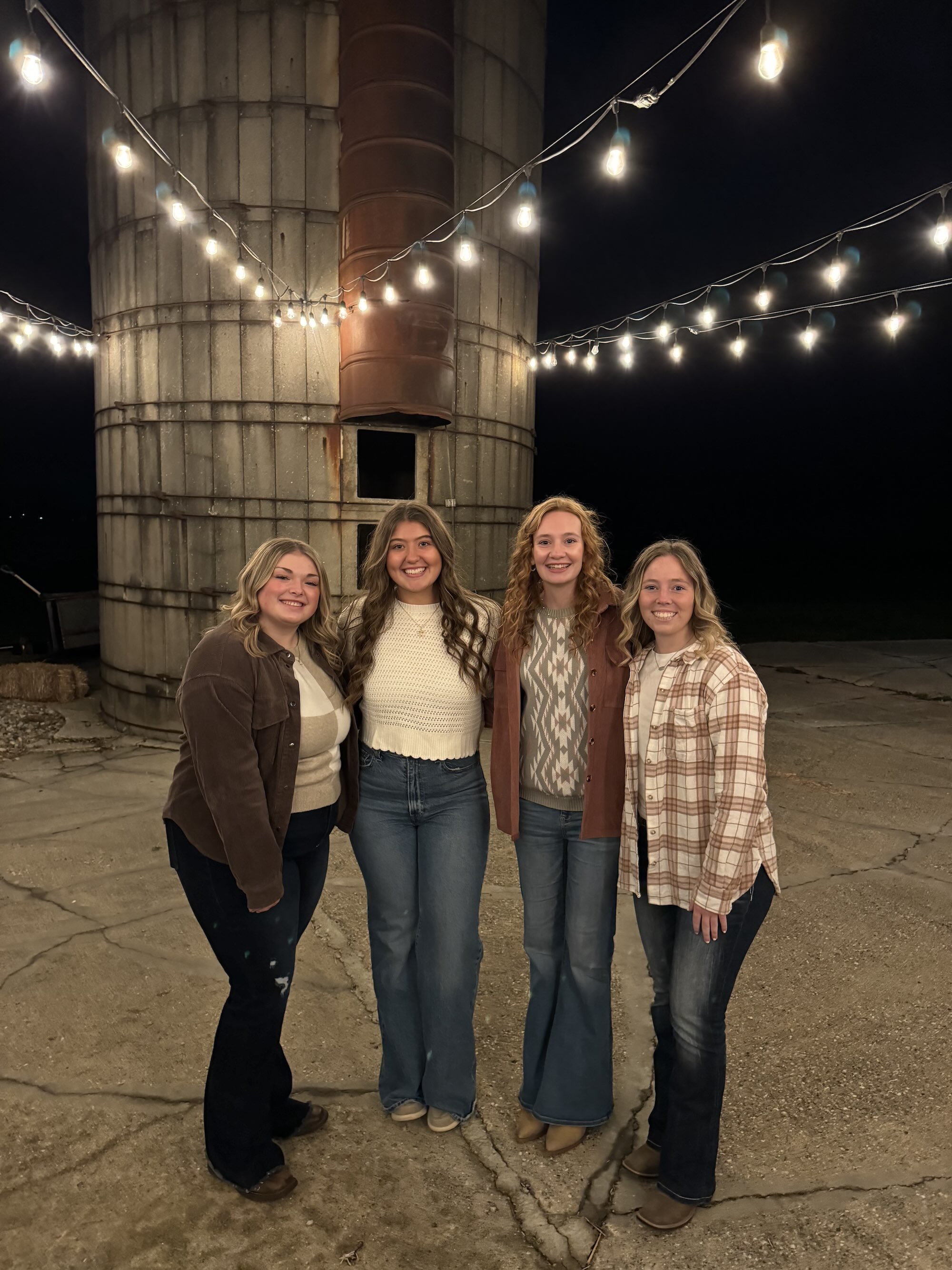 Walberg with friends in front of silo