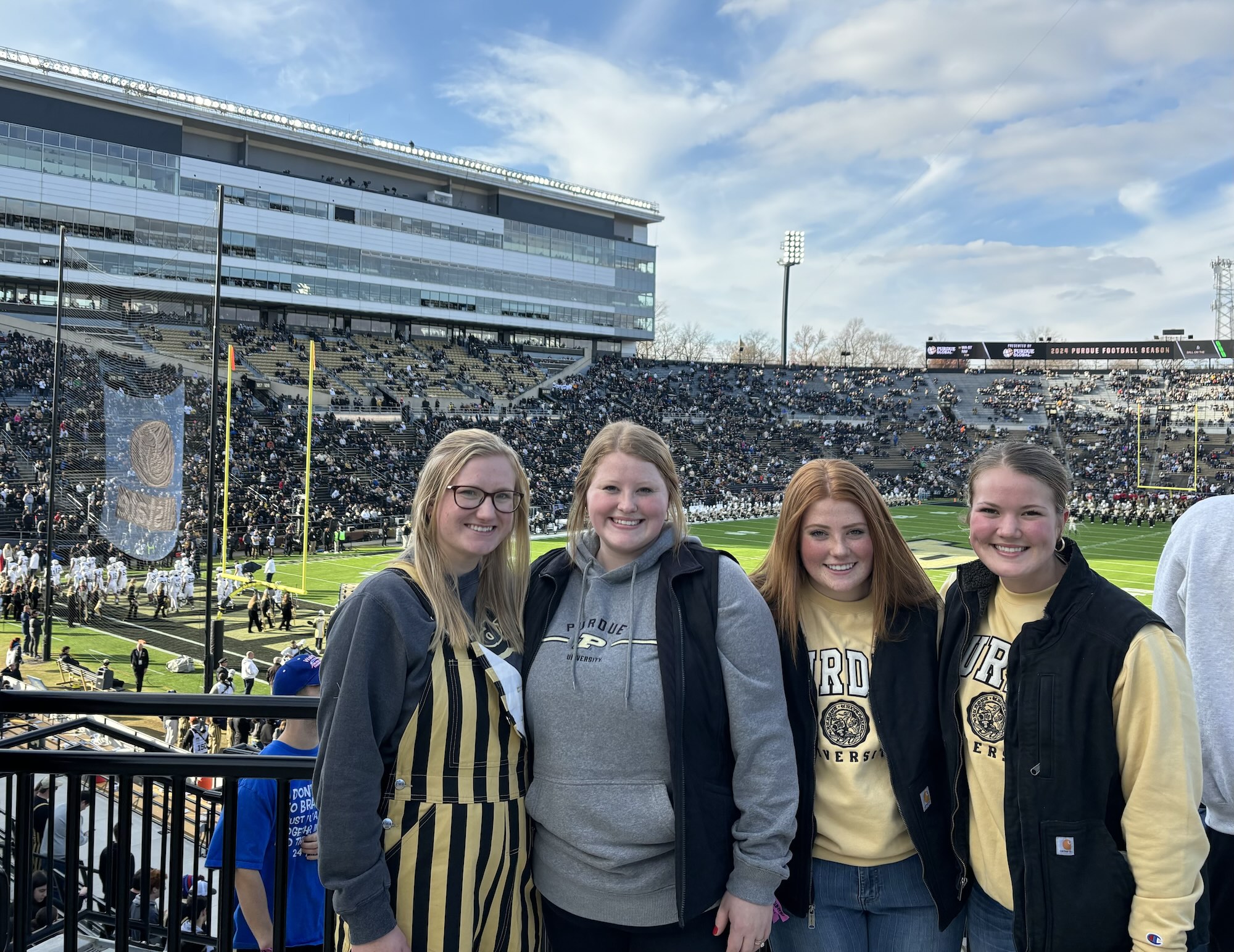 Alaina with friends at a football game