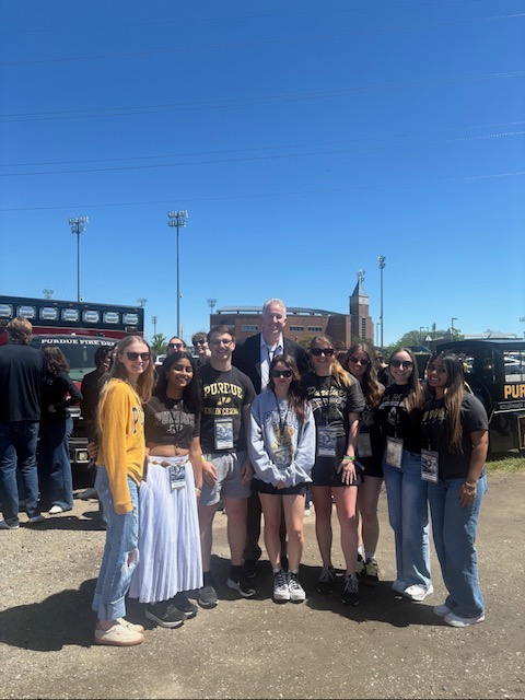 Anglemyer with friends in front of Ross-Ade Stadium