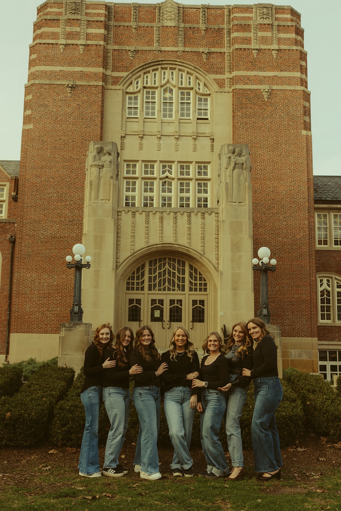 Cooper standing with friends in front of Purdue Memorial Union building