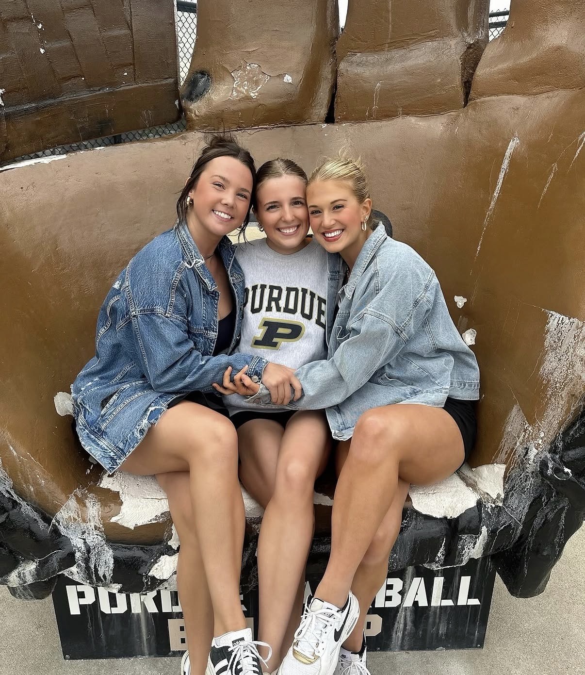 Fitzmorris with friends on Purdue baseball glove statue