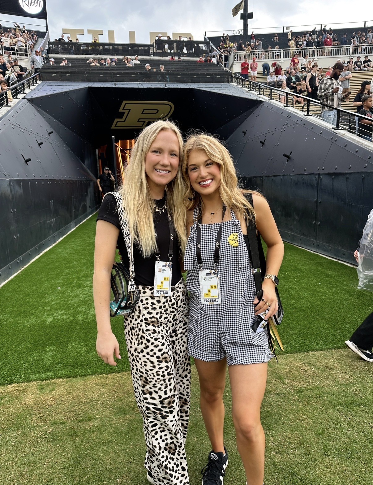 Fitzmorris standing with Reagan Koester in front of the Ross-Ade Stadium entry tunnel on the field