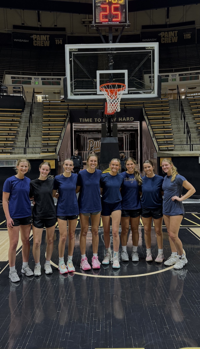 Frey with intramural sports team on a basketball court