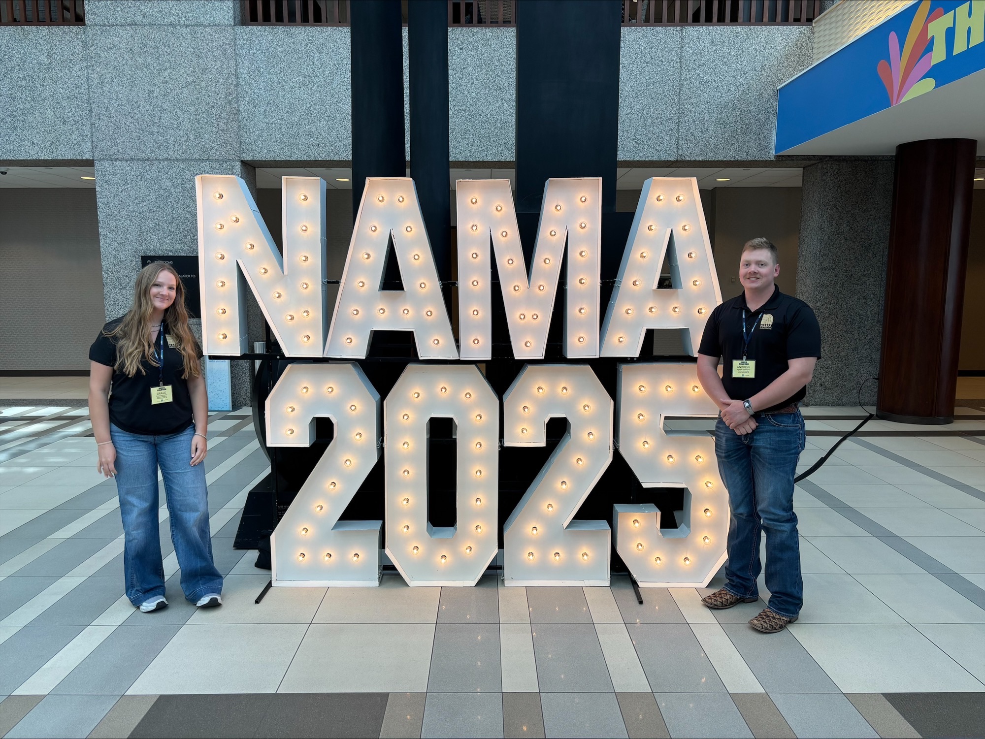 Klinkhamer with teammate in front of NAMA 2025 sign