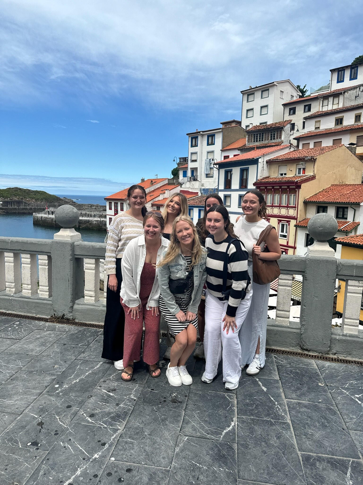 Koester posing with group on a bridge in Italy