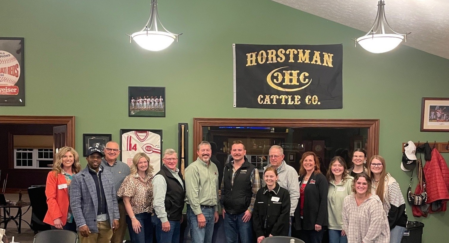 Phillips standing with colleagues in Horstman cattle building