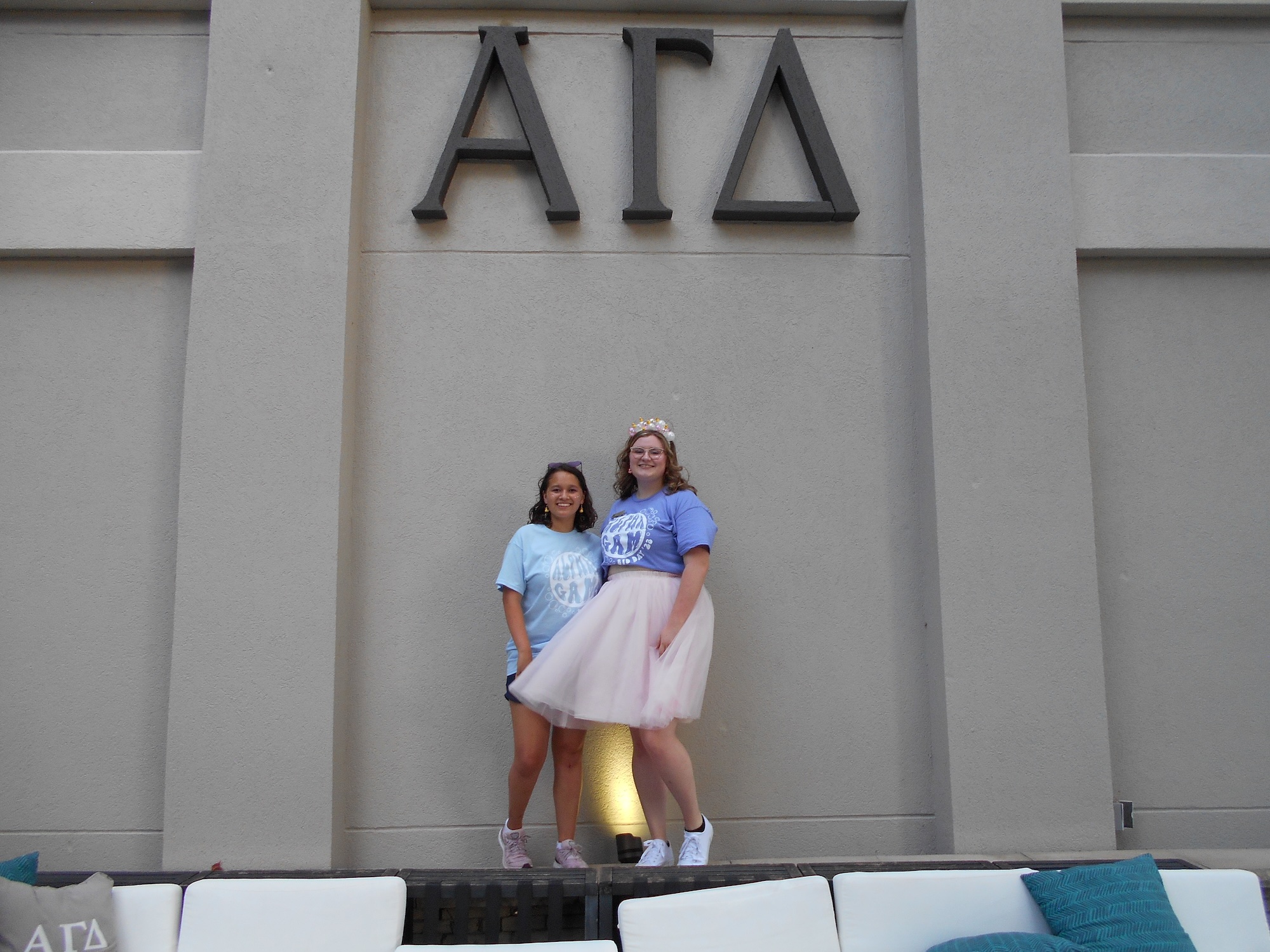 Piliang with friend in front of sorority building