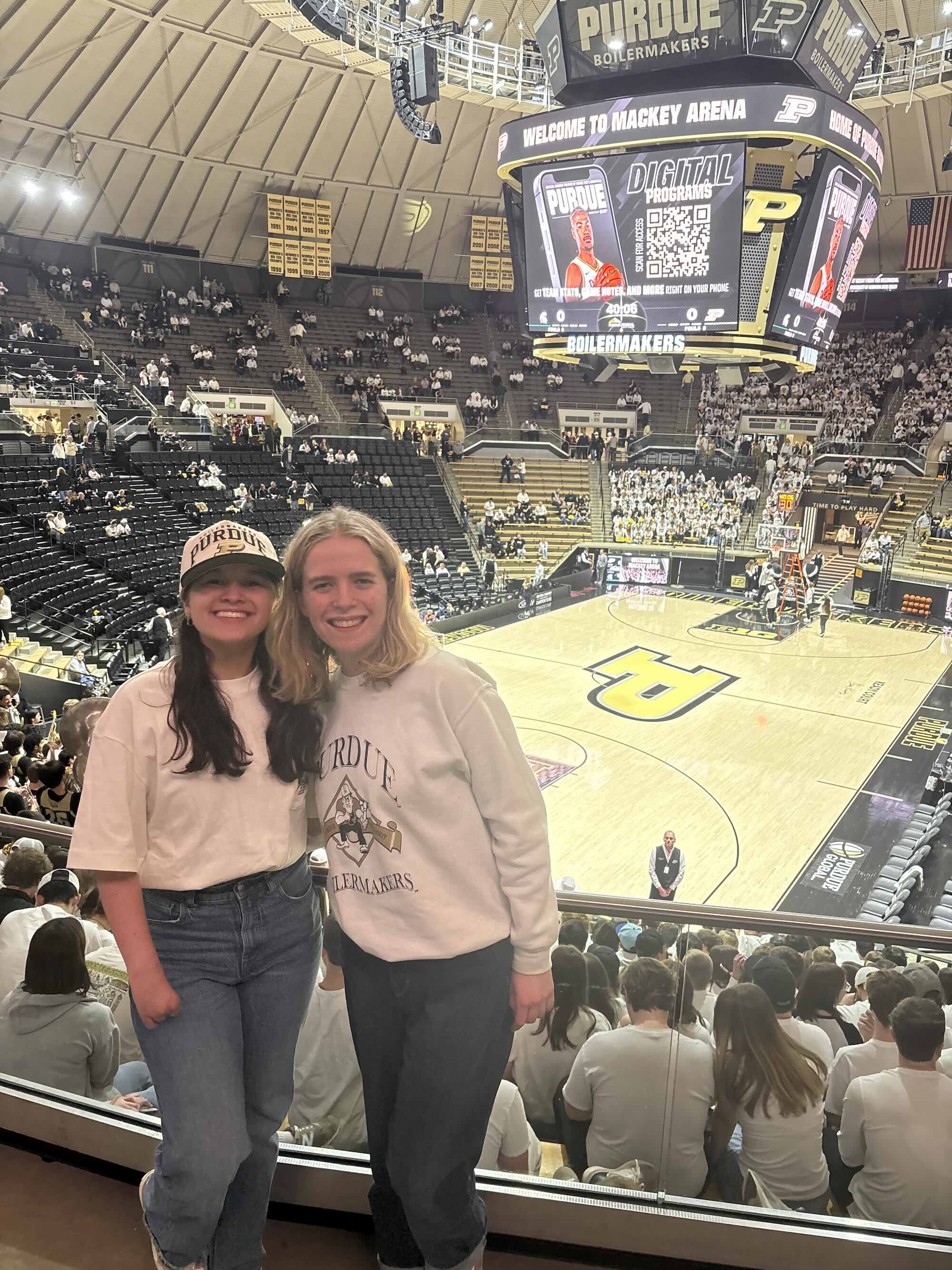 Piliang standing with a friend in Mackey