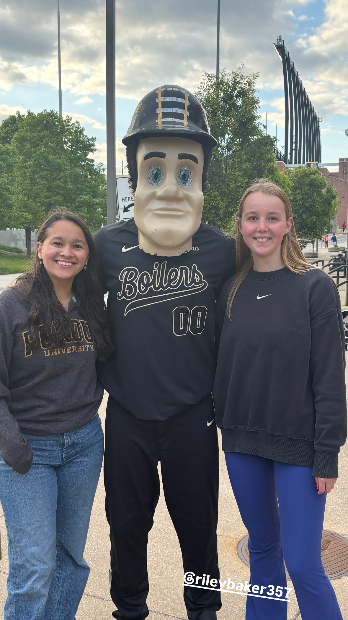 Piliang with a friend standing with Purdue Pete