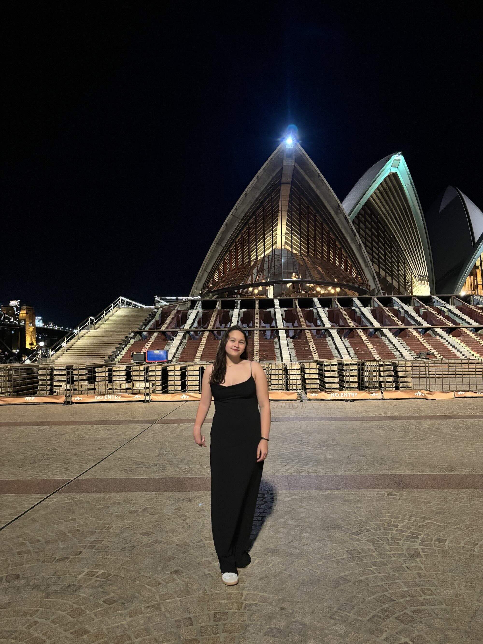 Piliang standing in front of the Sydney Opera House