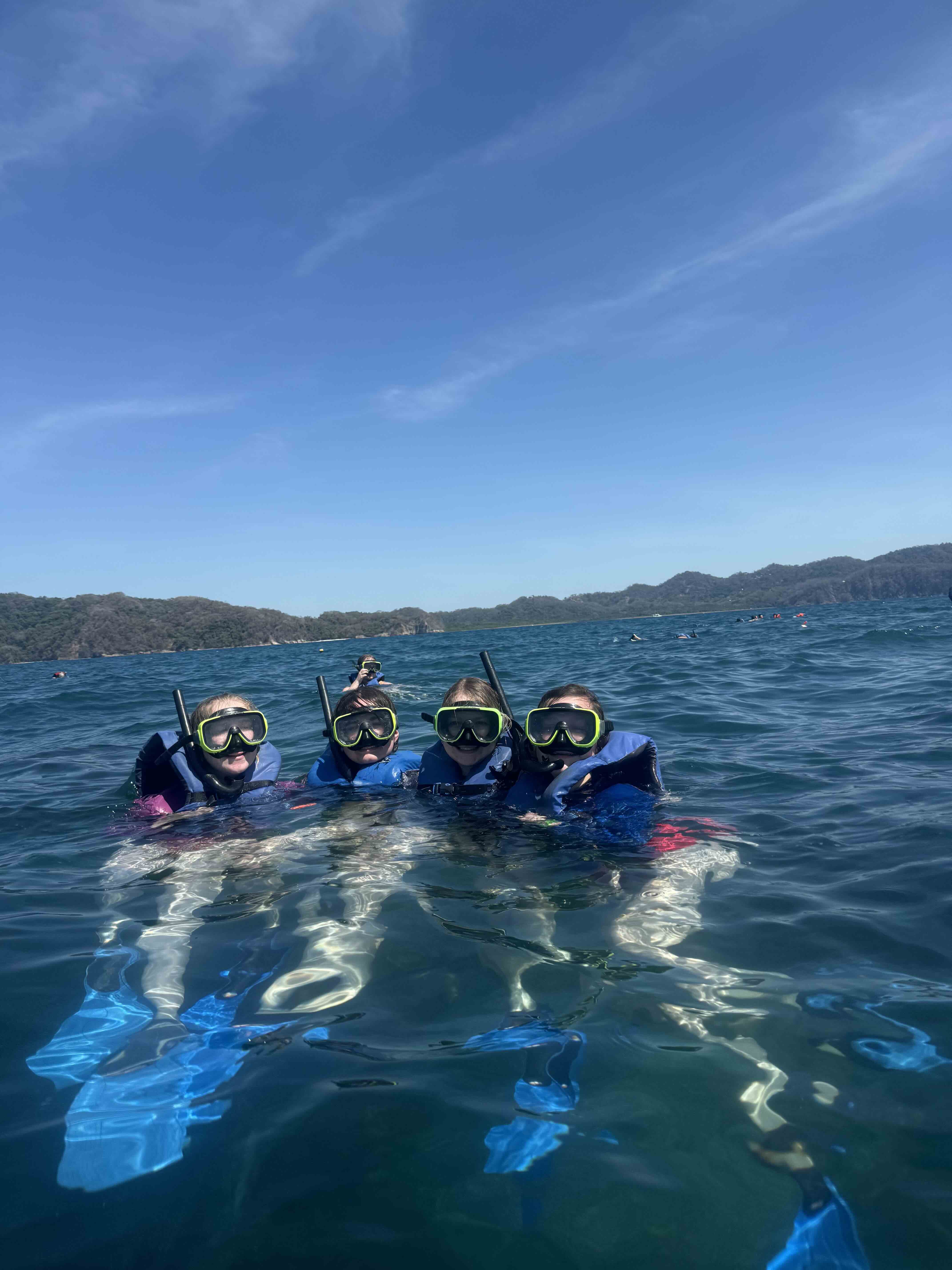 Larrison snorkeling with friends