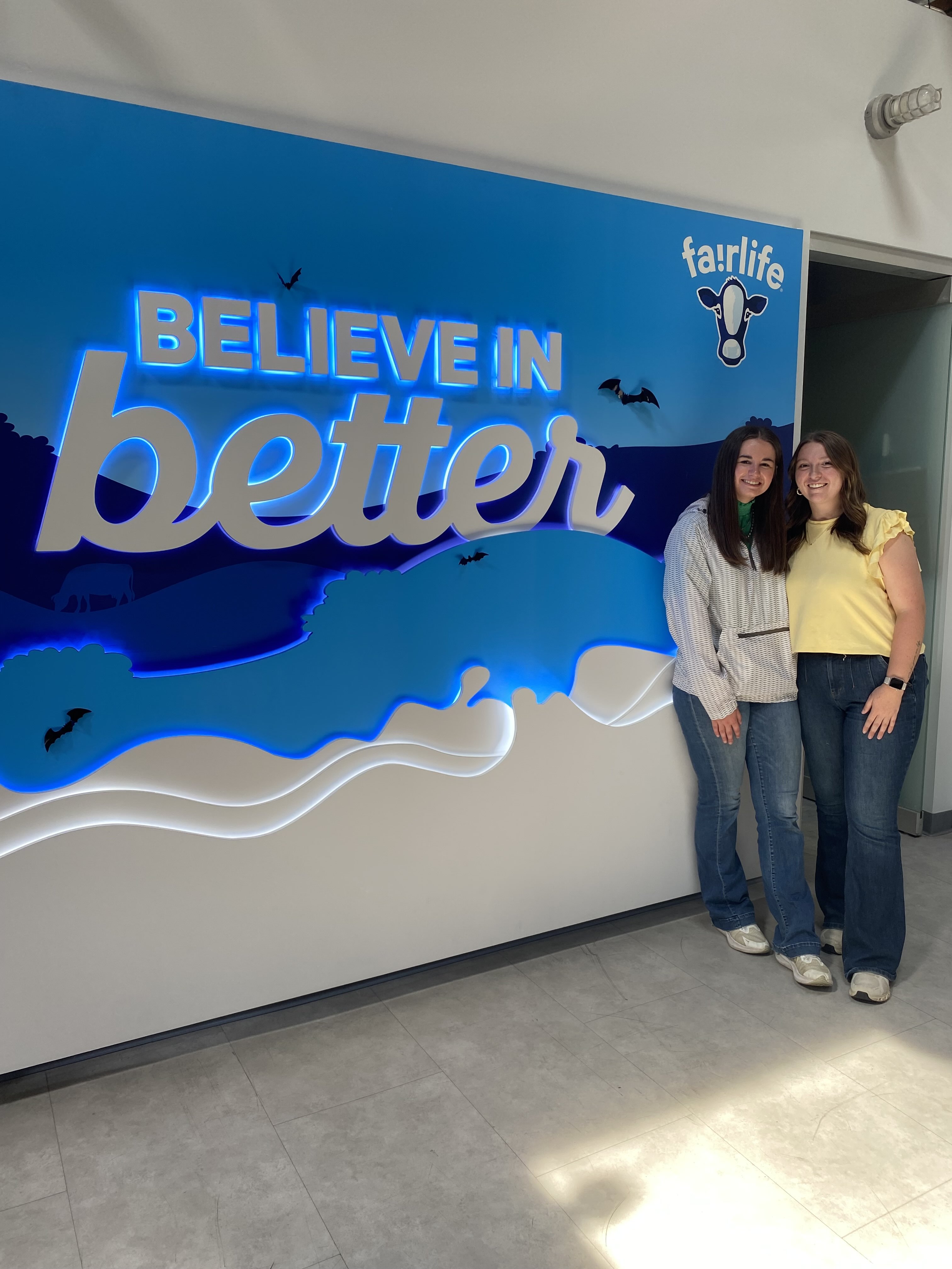 Kylie and Laci in front of Fairlife sign