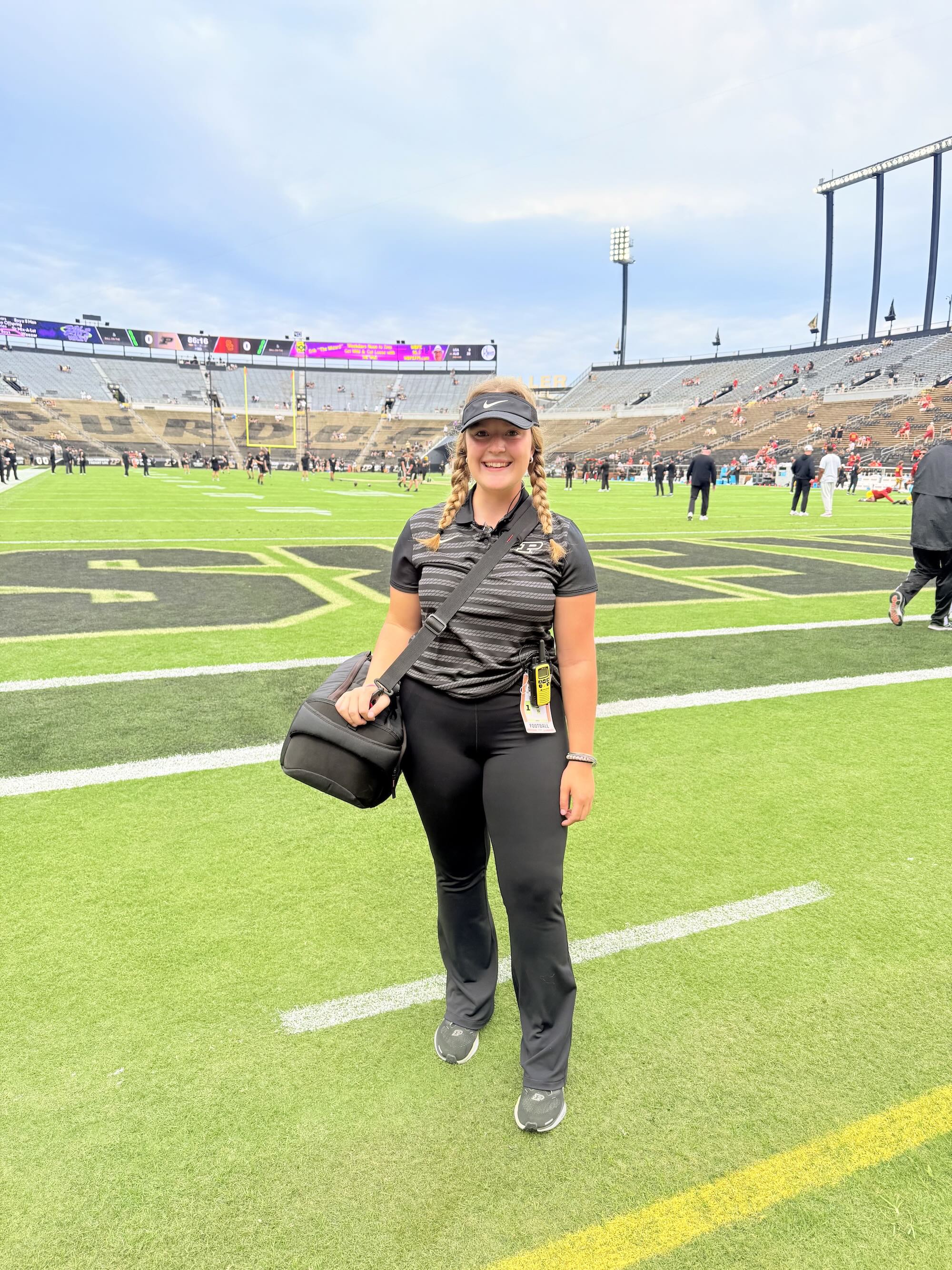 Dodds standing on the football field