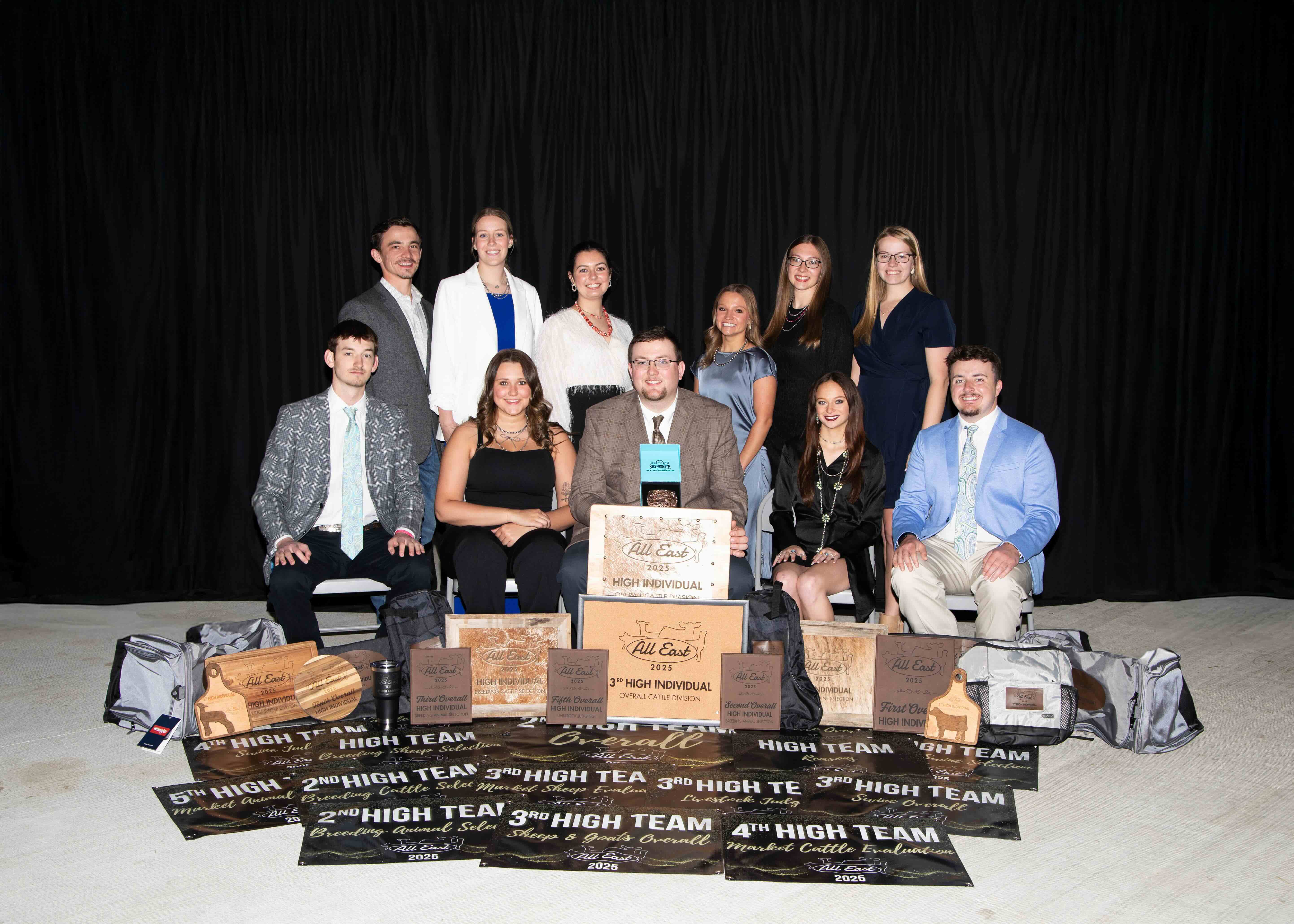 Livestock judging team in front of banners
