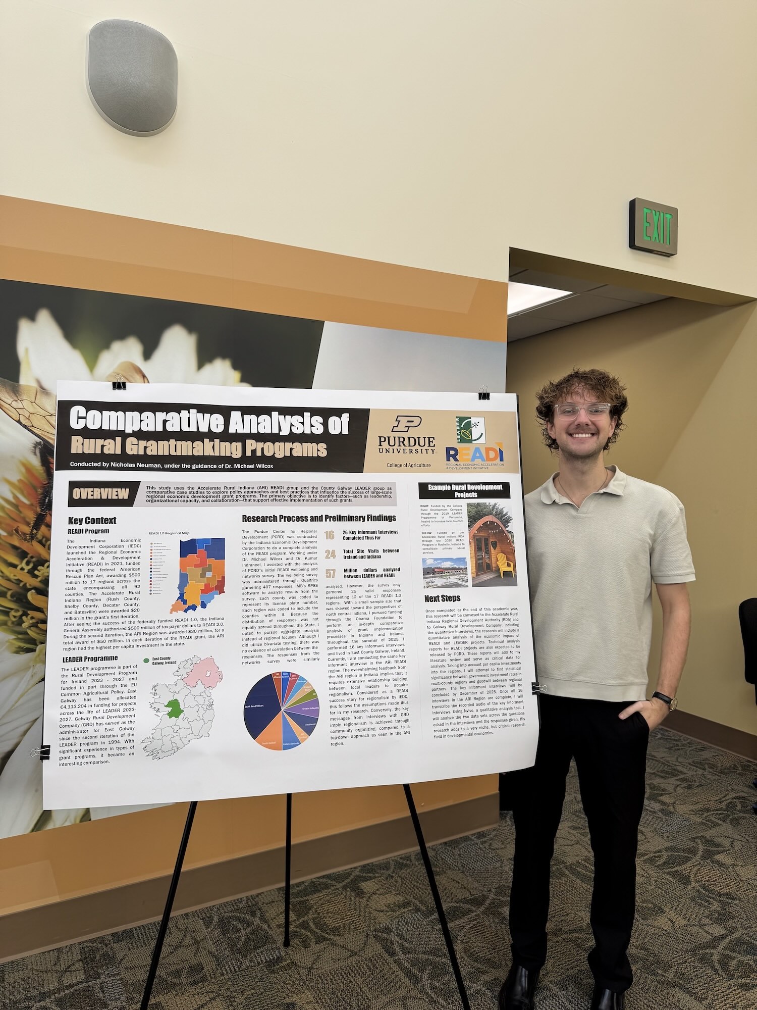 Nicholas Neuman at the PCARET conference with his research poster