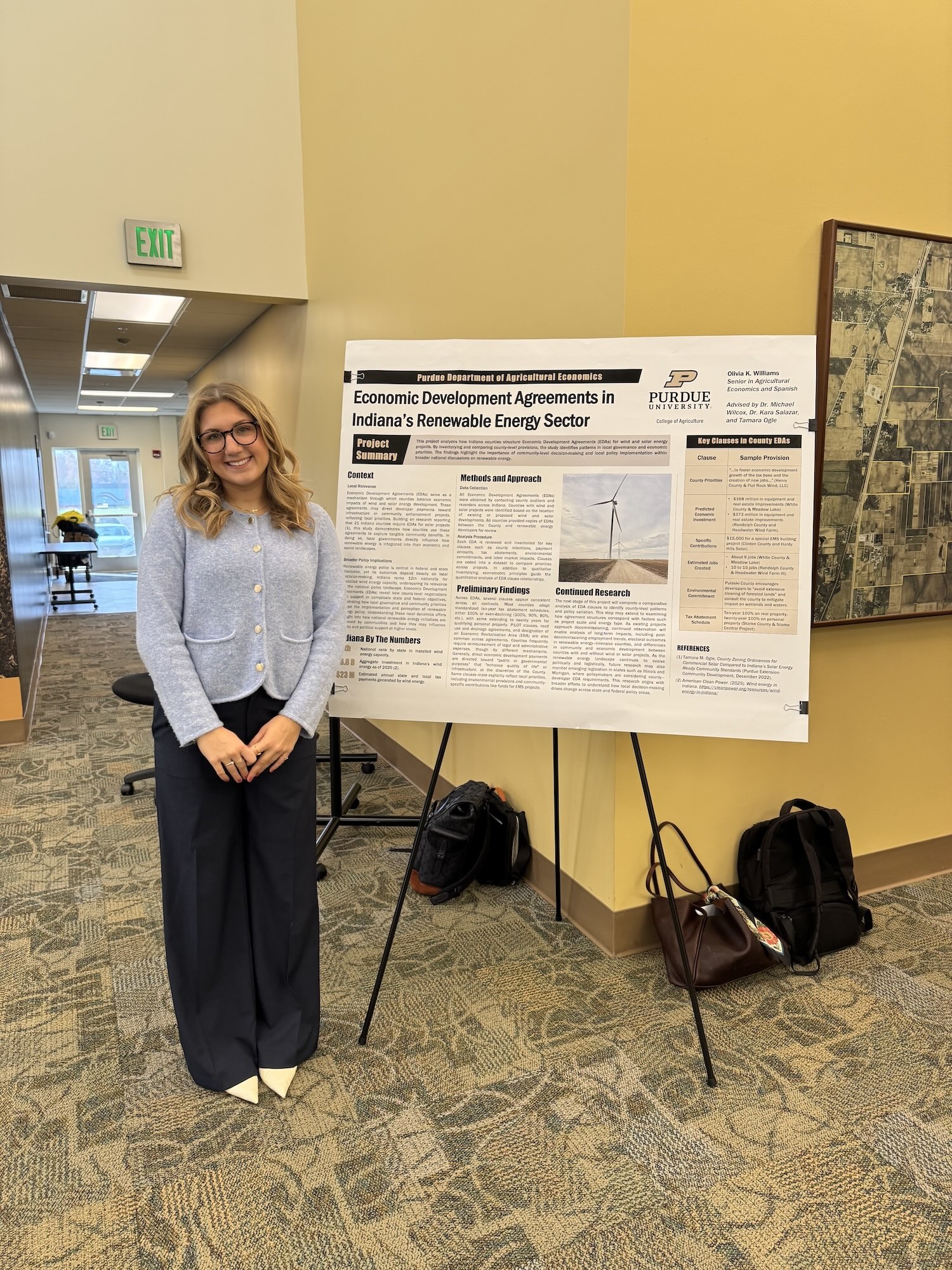 Olivia Williams at the PCARET conference with his research poster