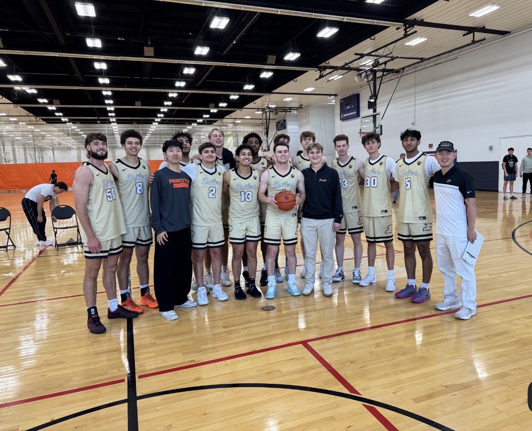 Purdue basketball team standing center court for a group photo