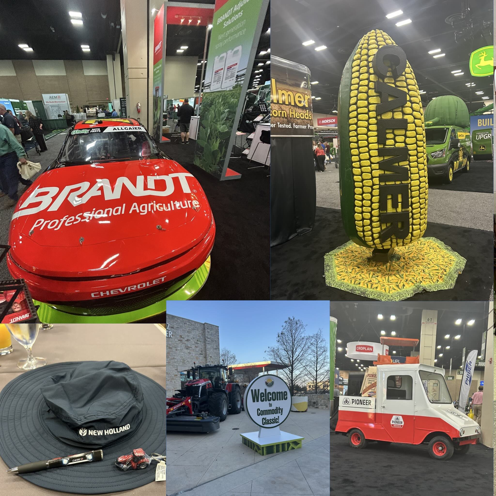Trade show scene with red Brandt race car, large corn-shaped Brandt display, tractors and Pioneer show vehicle.