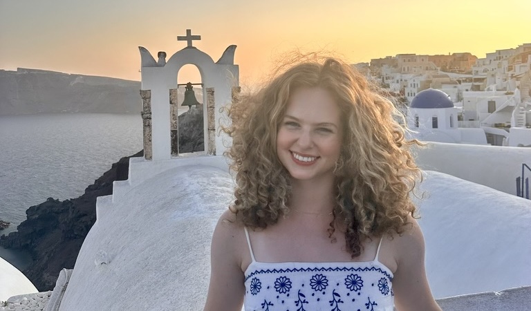 Madison in a Greek village overlooking the water