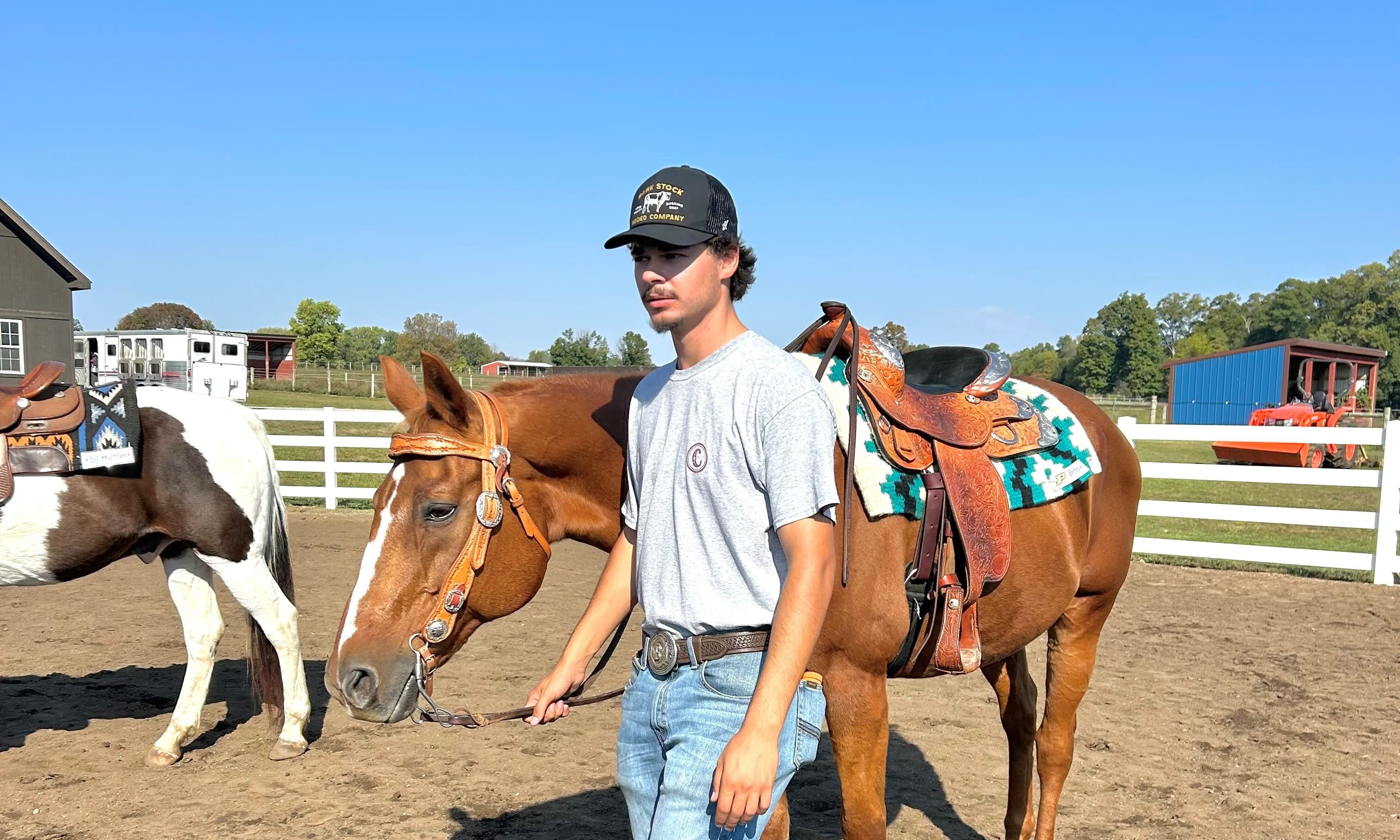 Braden walking a horse