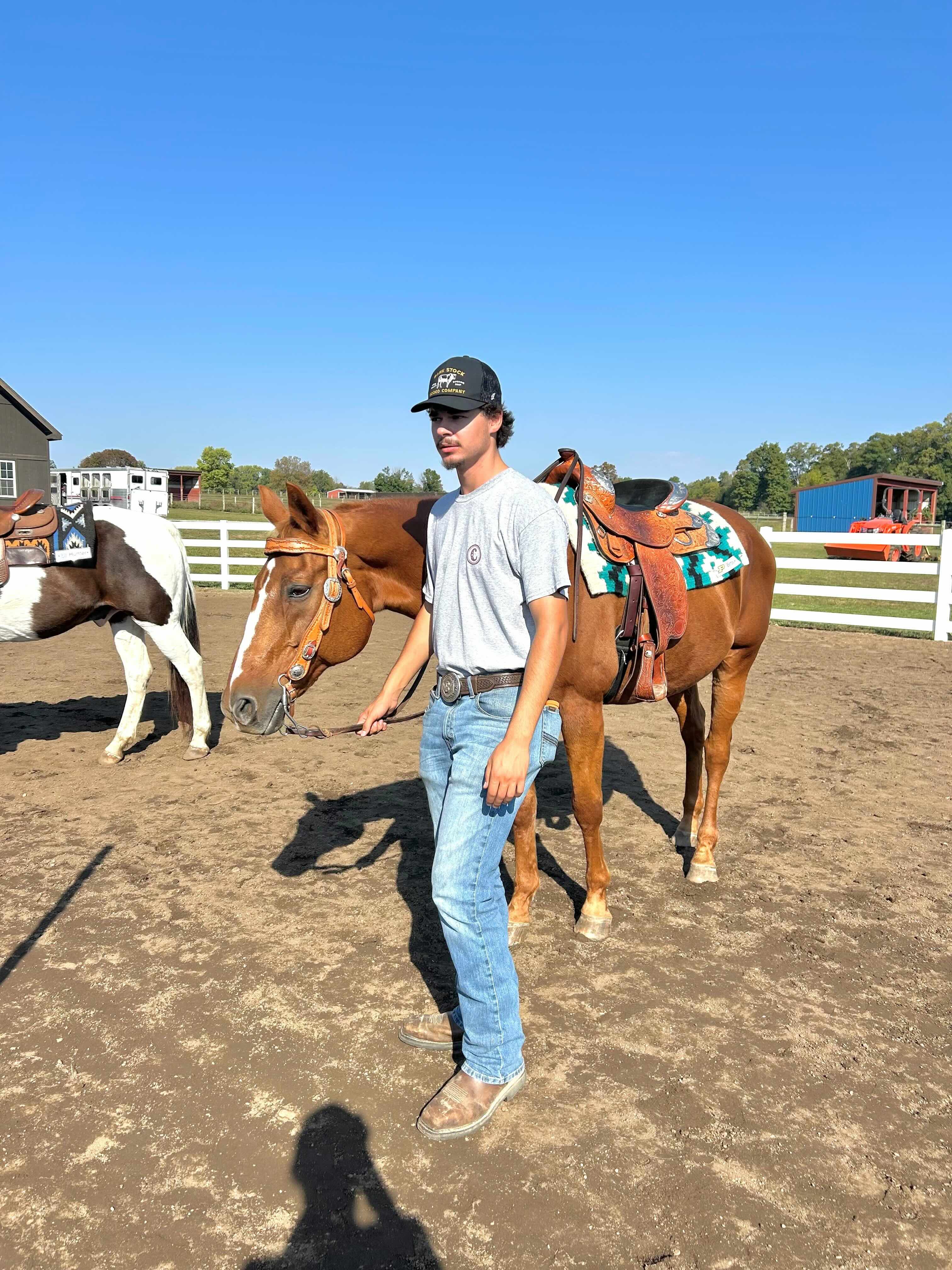 Braden walking a horse